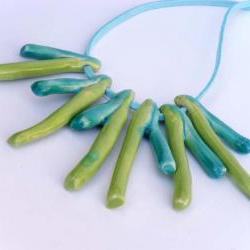 Statement necklace in shades of green and turquoise Spring trends 2012